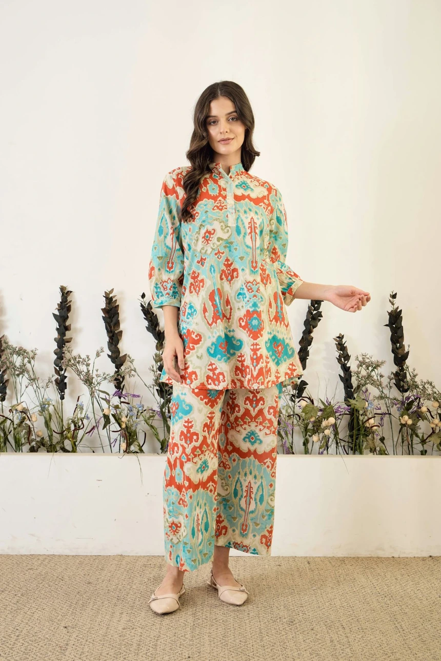 Woman in patterned tunic and pants